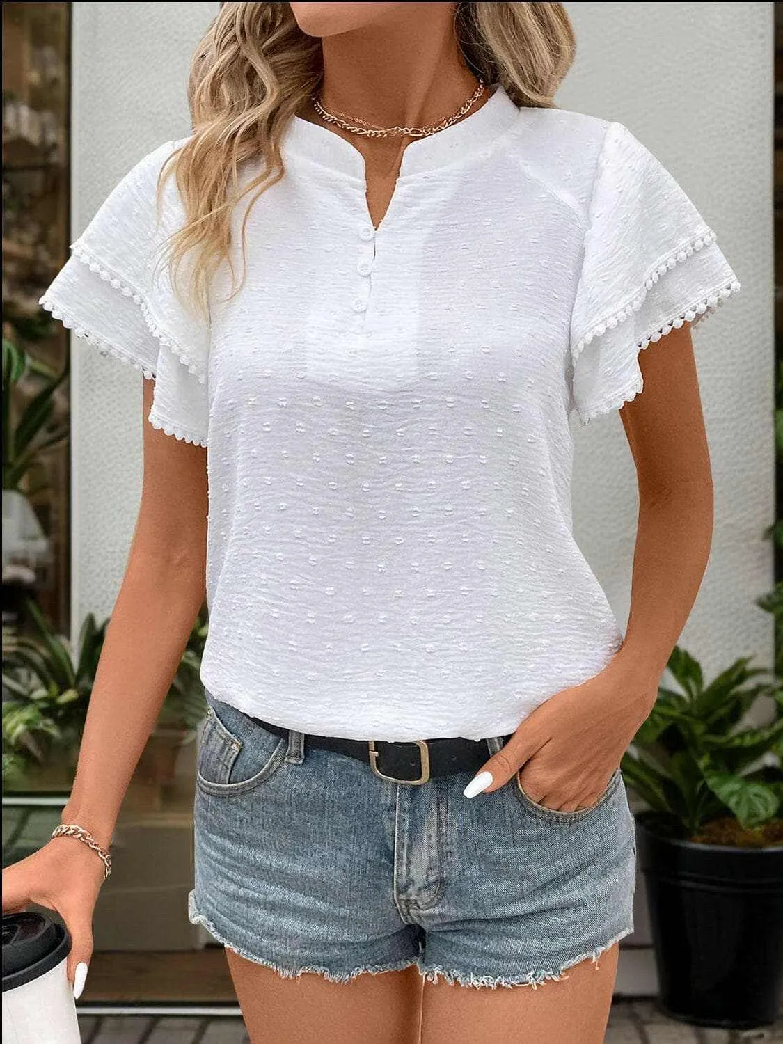 Chic Swiss dot notched blouse